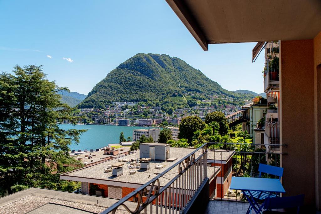 a balcony with a view of a mountain at Maraini 17 by Quokka 360 - panoramic flat near the station in Lugano