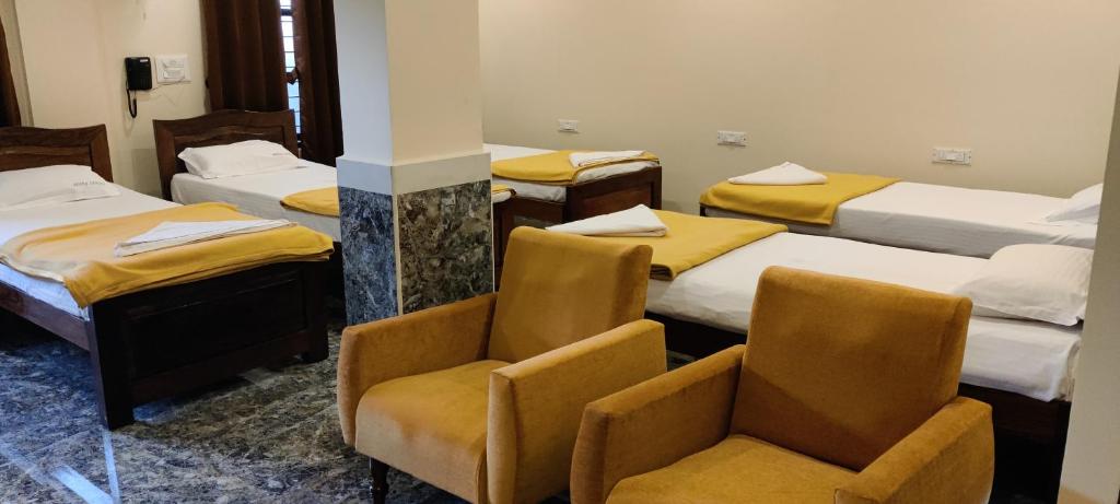 Postel nebo postele na pokoji v ubytování Sanjose Residency