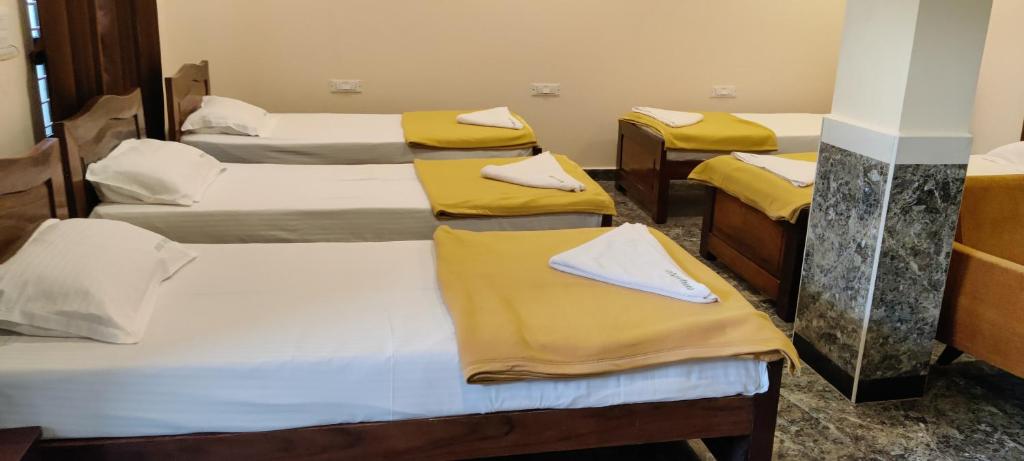Postel nebo postele na pokoji v ubytování Sanjose Residency
