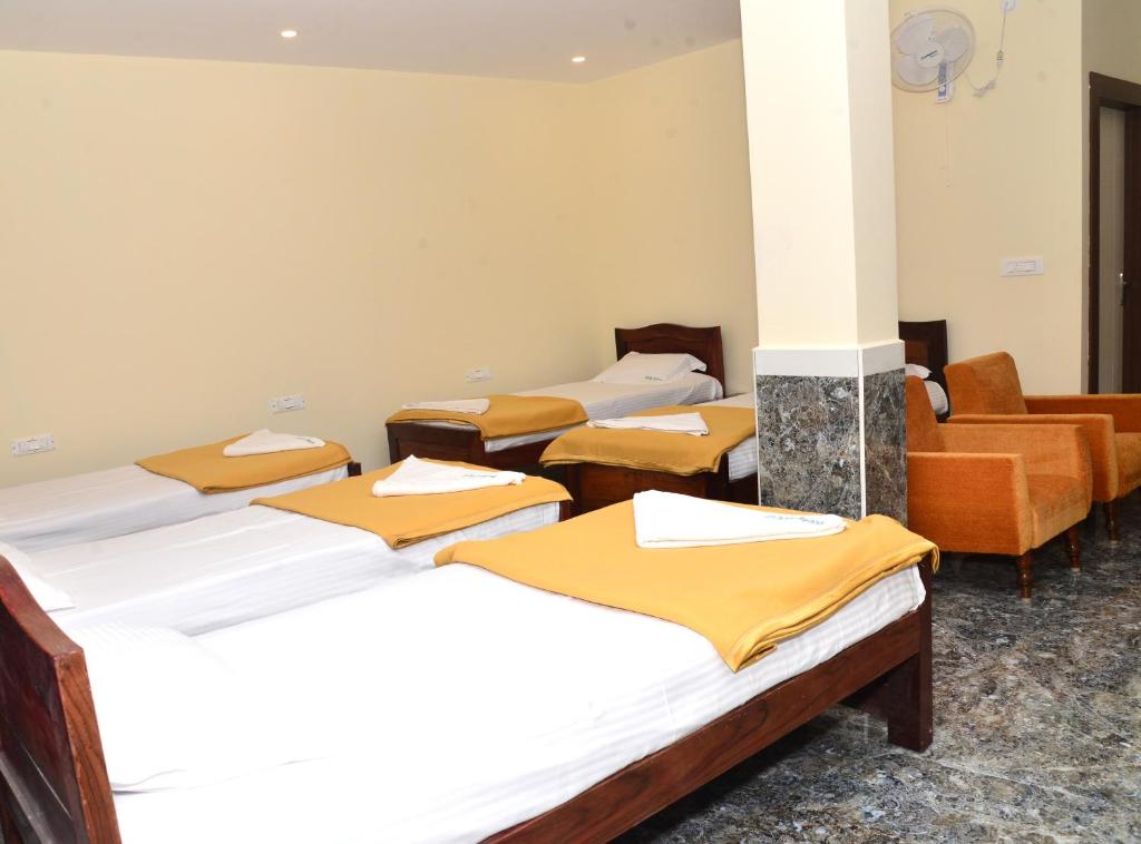Postel nebo postele na pokoji v ubytování Sanjose Residency