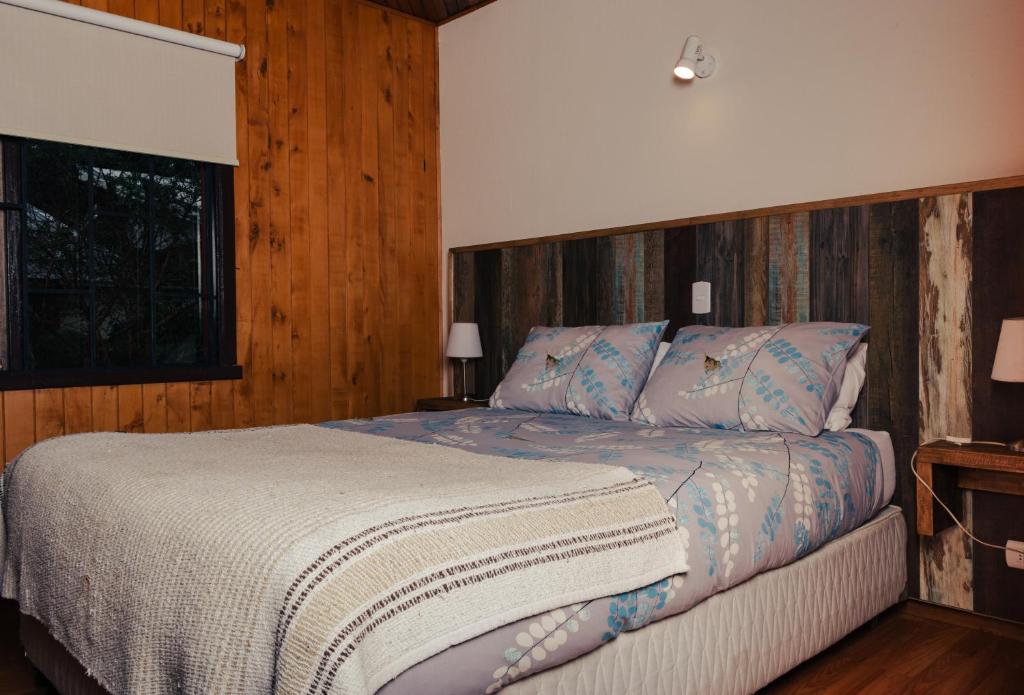 Postel nebo postele na pokoji v ubytování Hotel Terrazas del Lago