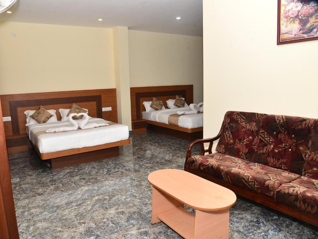 Postel nebo postele na pokoji v ubytování Sanjose Residency
