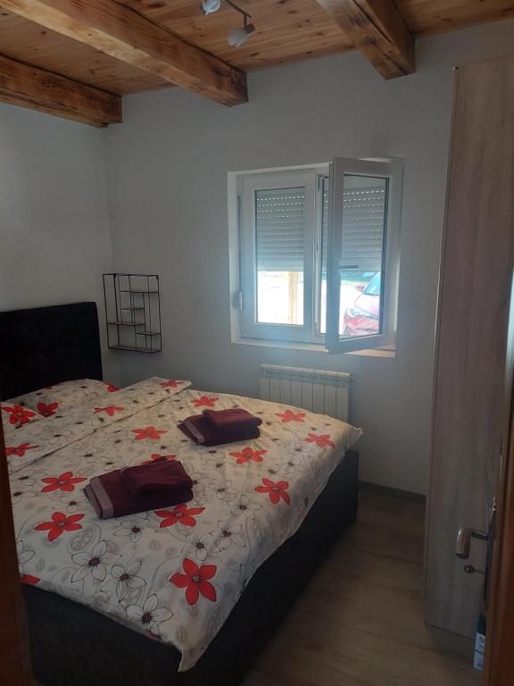 Postel nebo postele na pokoji v ubytování Apartmani Popovic Lux
