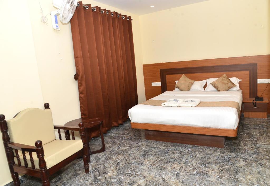 Postel nebo postele na pokoji v ubytování Sanjose Residency