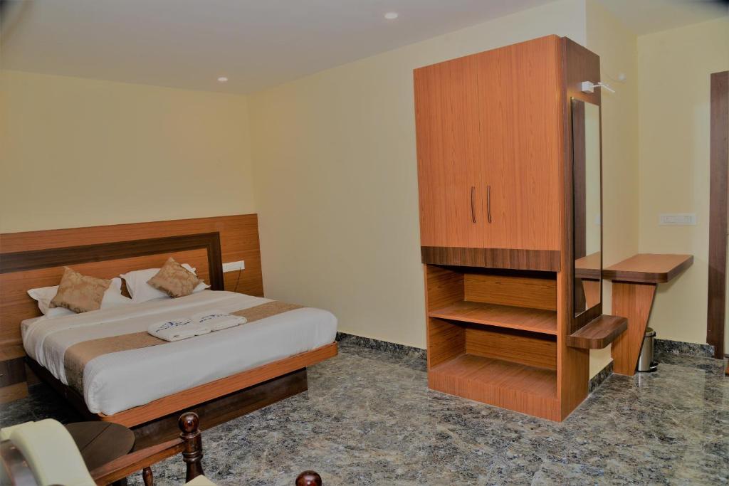 Postel nebo postele na pokoji v ubytování Sanjose Residency