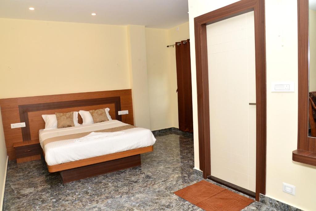 Postel nebo postele na pokoji v ubytování Sanjose Residency