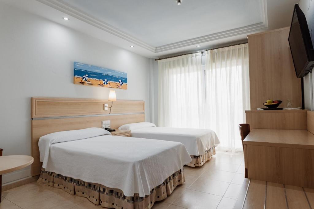 Postel nebo postele na pokoji v ubytování Hotel Las Gaviotas