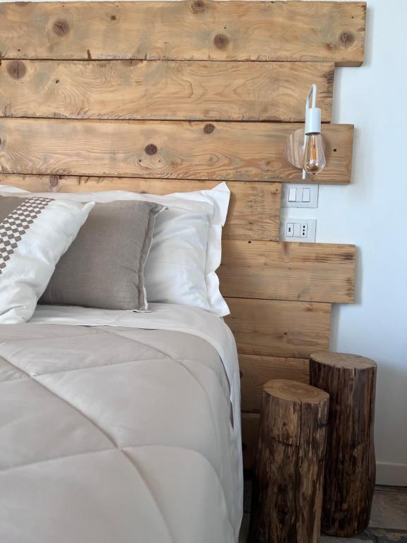 Łóżko lub łóżka w pokoju w obiekcie Ca di Timo B&B