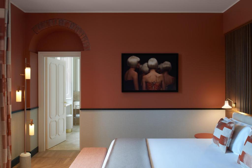 Postel nebo postele na pokoji v ubytování Amabilia Suites