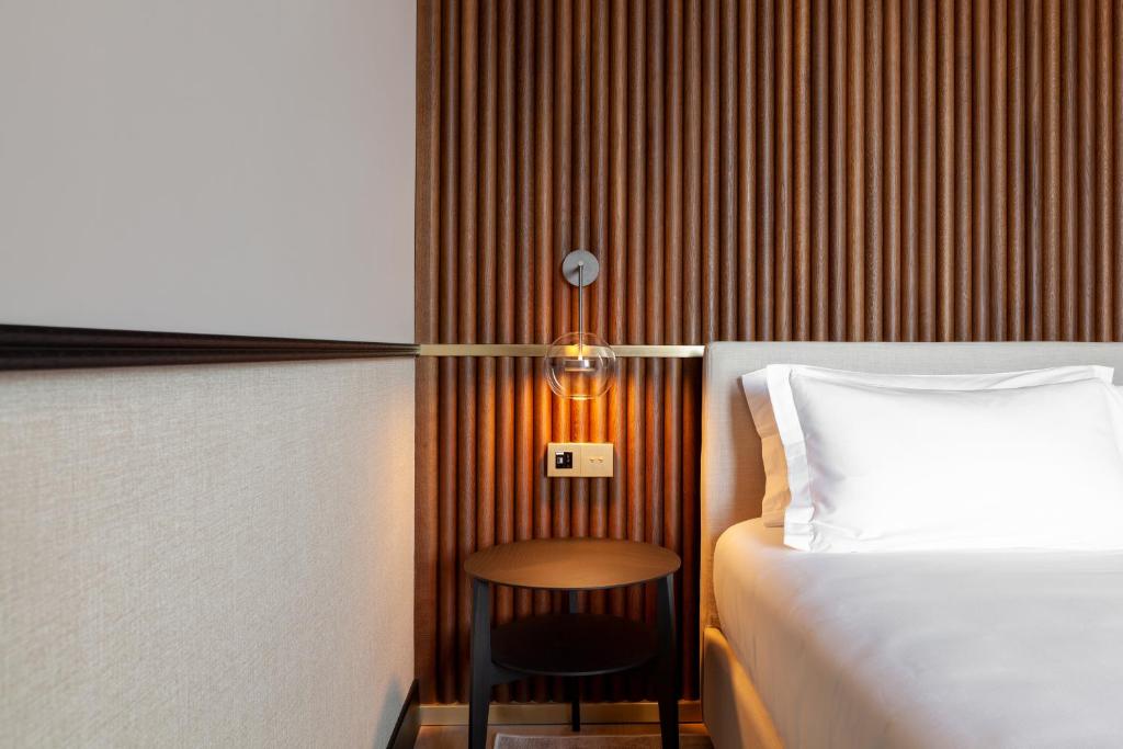 Postel nebo postele na pokoji v ubytování Amabilia Suites