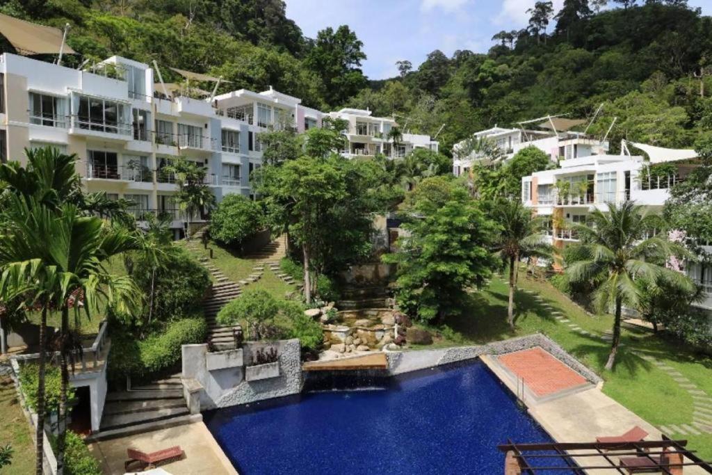 an aerial view of a resort with a swimming pool at kamala hills estate A102 in Kamala Beach