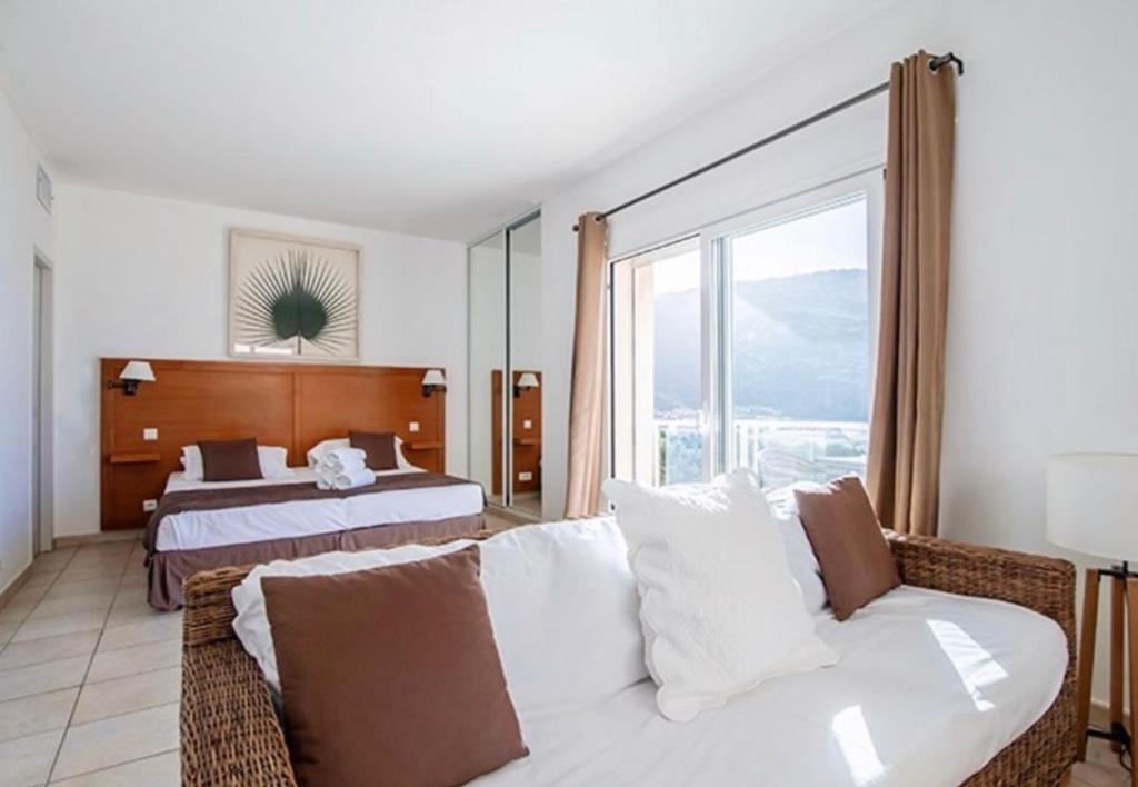 Postel nebo postele na pokoji v ubytování Hôtel Lilium Maris