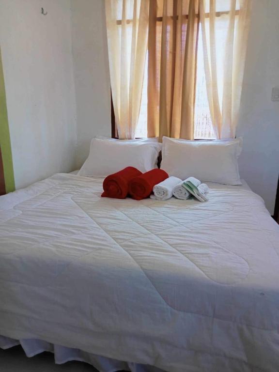 Postel nebo postele na pokoji v ubytování JCAH BEACH HOUSE free WiFi