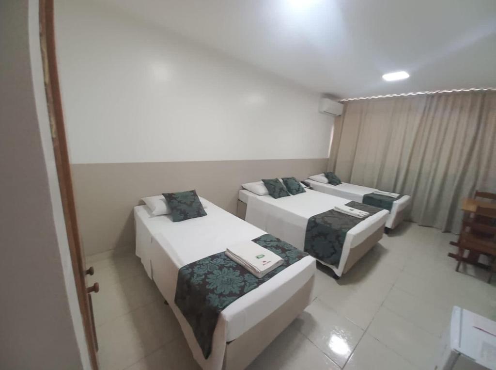 Postel nebo postele na pokoji v ubytování Max Hotel
