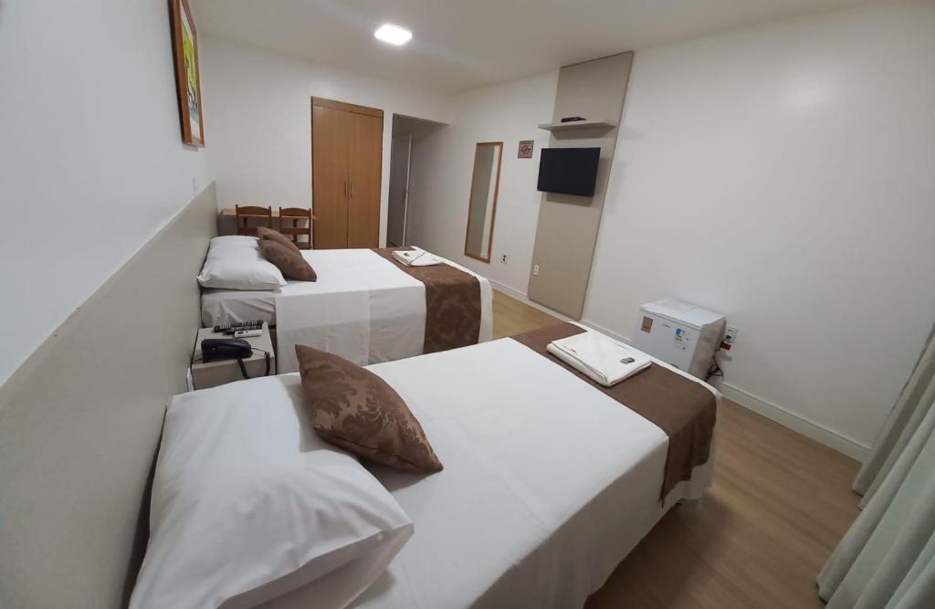 Postel nebo postele na pokoji v ubytování Max Hotel