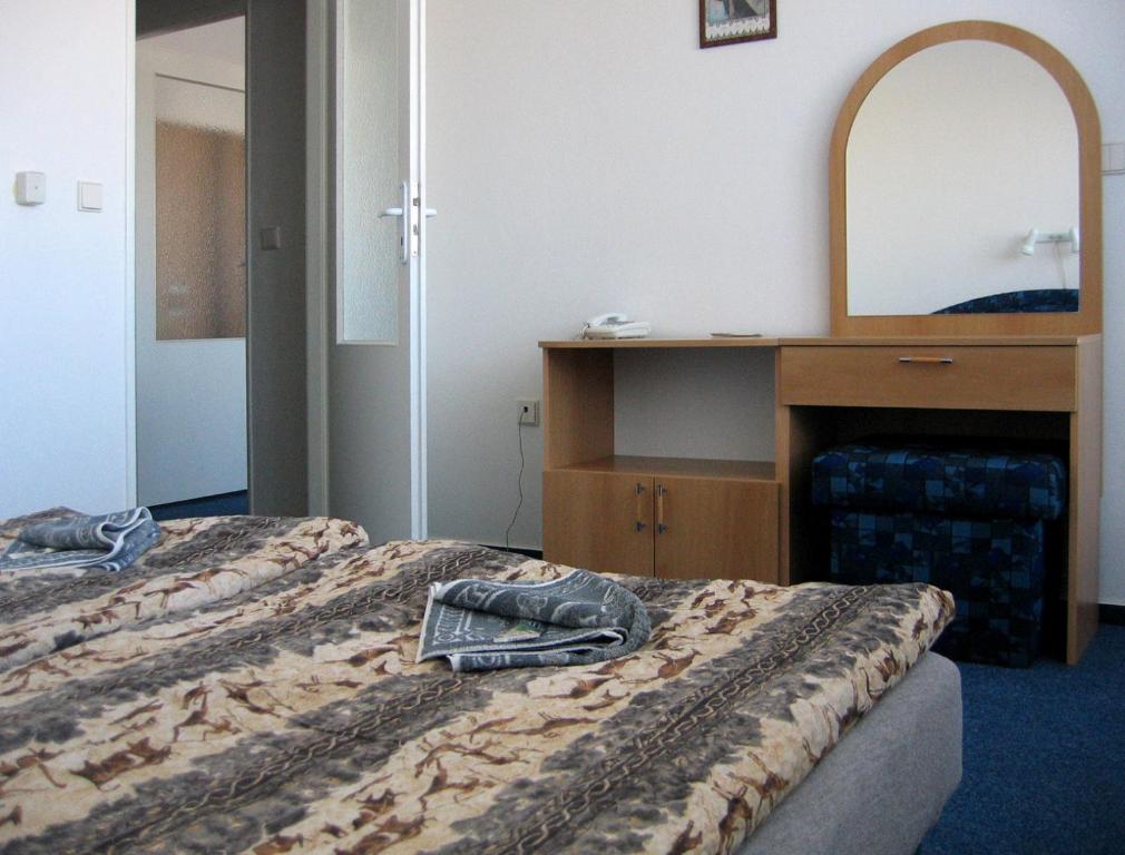 Postel nebo postele na pokoji v ubytování Hotel Morava
