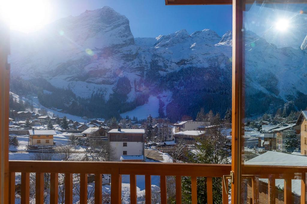 a view of a snow covered mountain from a balcony at Résidence Goélia Le Blanchot in Pralognan-la-Vanoise