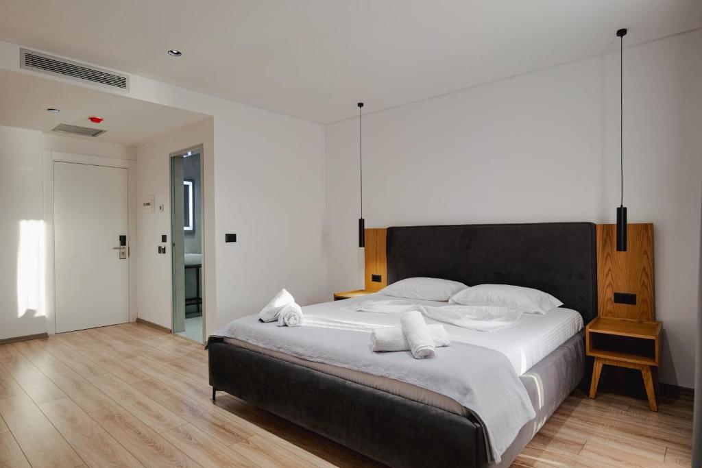 Postel nebo postele na pokoji v ubytování Hotel Vola
