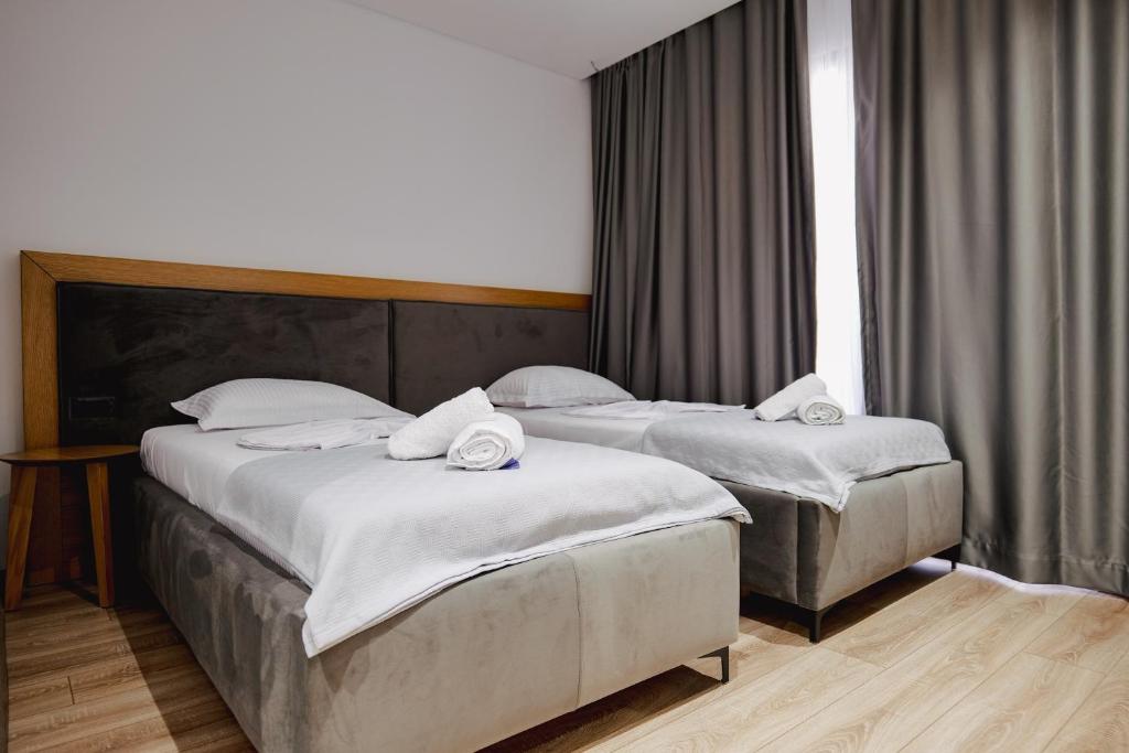 Postel nebo postele na pokoji v ubytování Hotel Vola