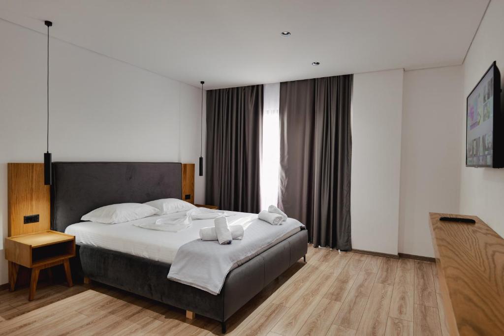 Postel nebo postele na pokoji v ubytování Hotel Vola
