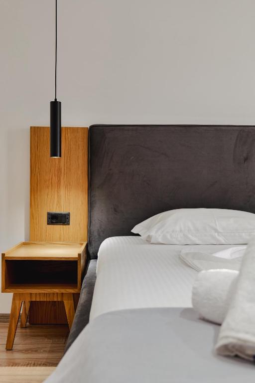 Postel nebo postele na pokoji v ubytování Hotel Vola