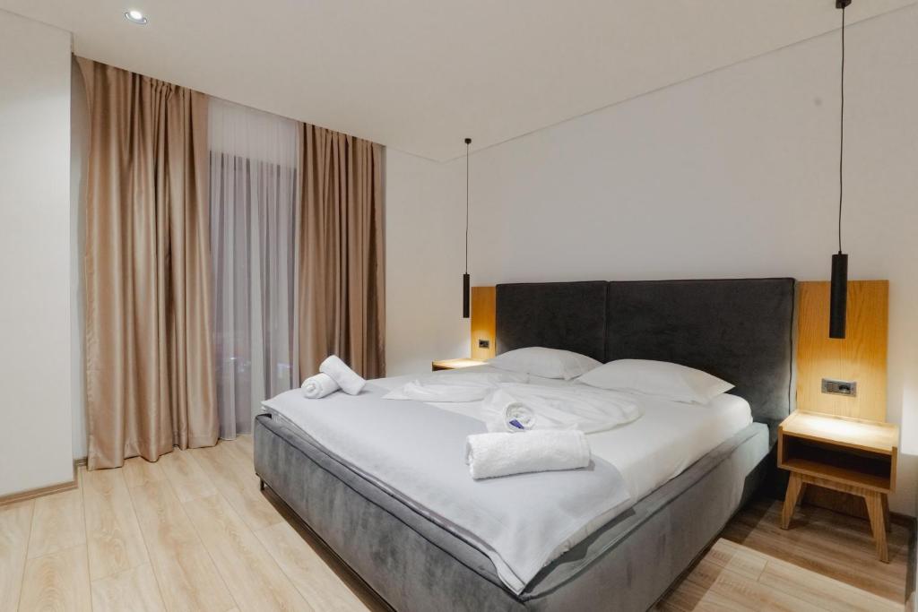 Postel nebo postele na pokoji v ubytování Hotel Vola