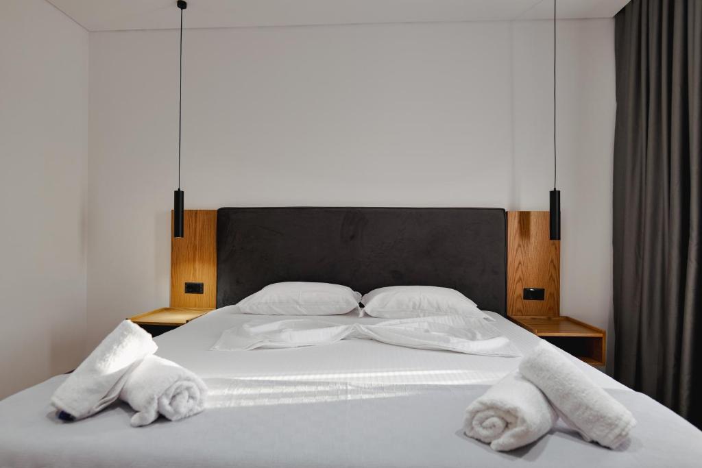 Postel nebo postele na pokoji v ubytování Hotel Vola