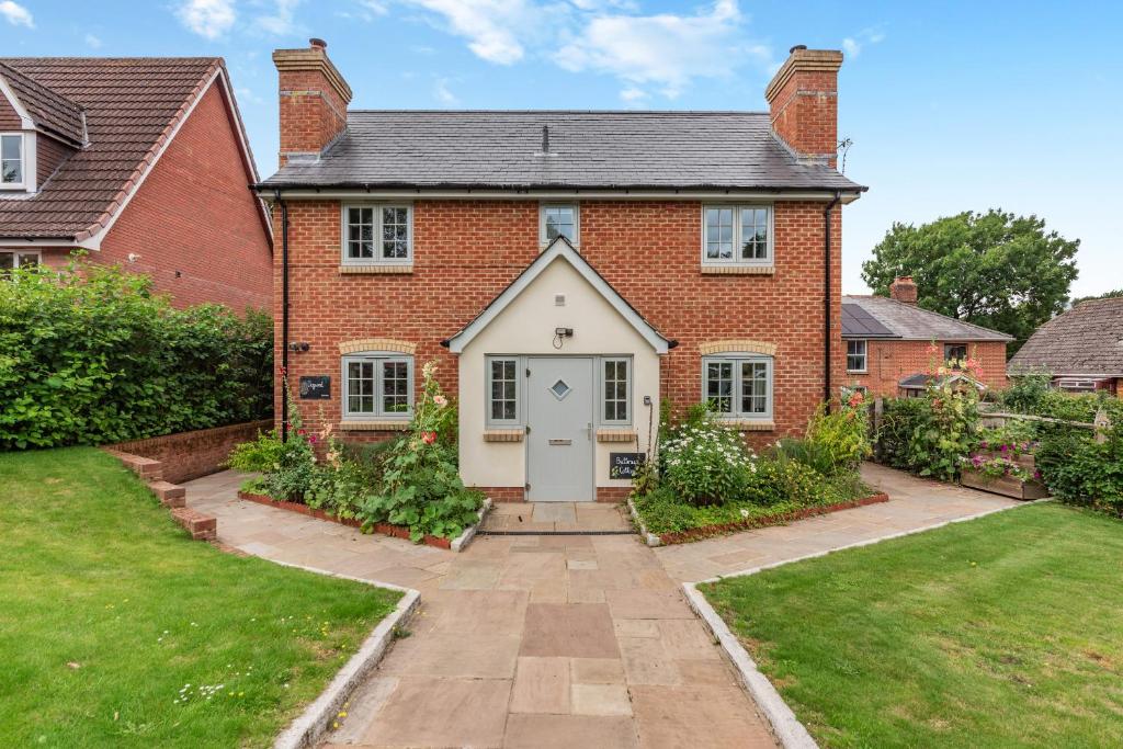 a red brick house with a white door at Dogwood in Salisbury