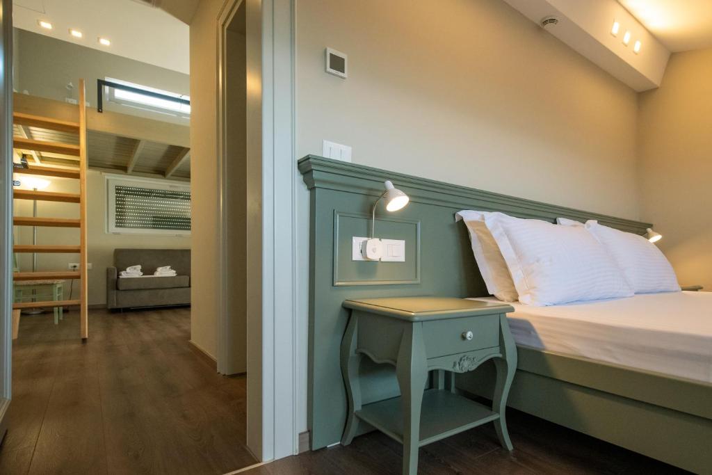 Postel nebo postele na pokoji v ubytování Hotel Vila 11