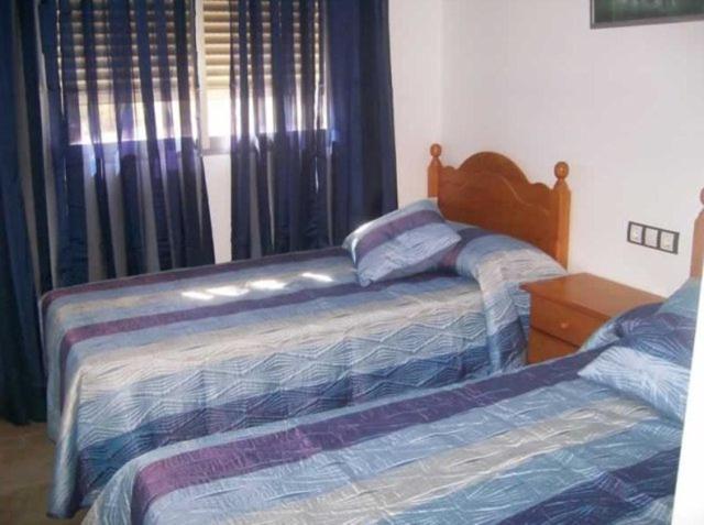 Posteľ alebo postele v izbe v ubytovaní Apartamentos Albamar II
