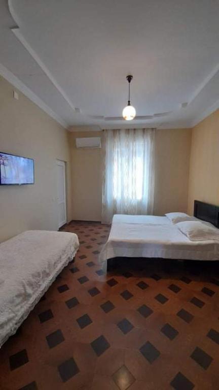 Postel nebo postele na pokoji v ubytování Guest House Gio