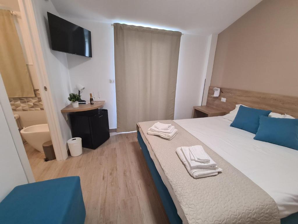 Giường trong phòng chung tại B&B Al Quadrato