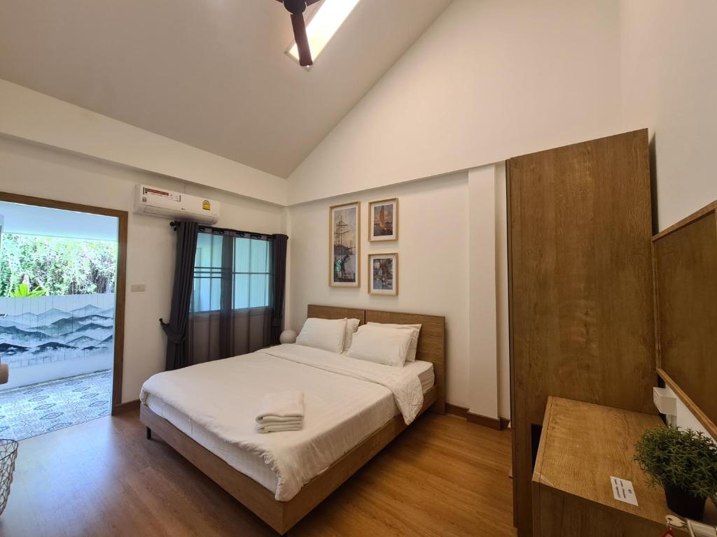 Postel nebo postele na pokoji v ubytování Nimman Home 4 bedrooms