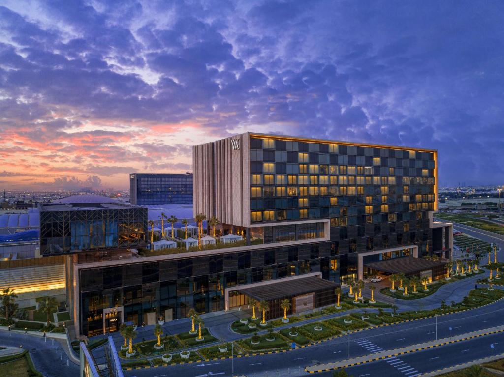 a rendering of a building at dusk at Waldorf Astoria Kuwait in Kuwait