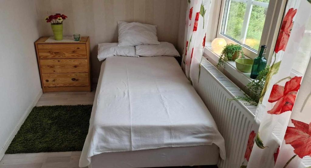 Postel nebo postele na pokoji v ubytování Berggården Vandrarhem