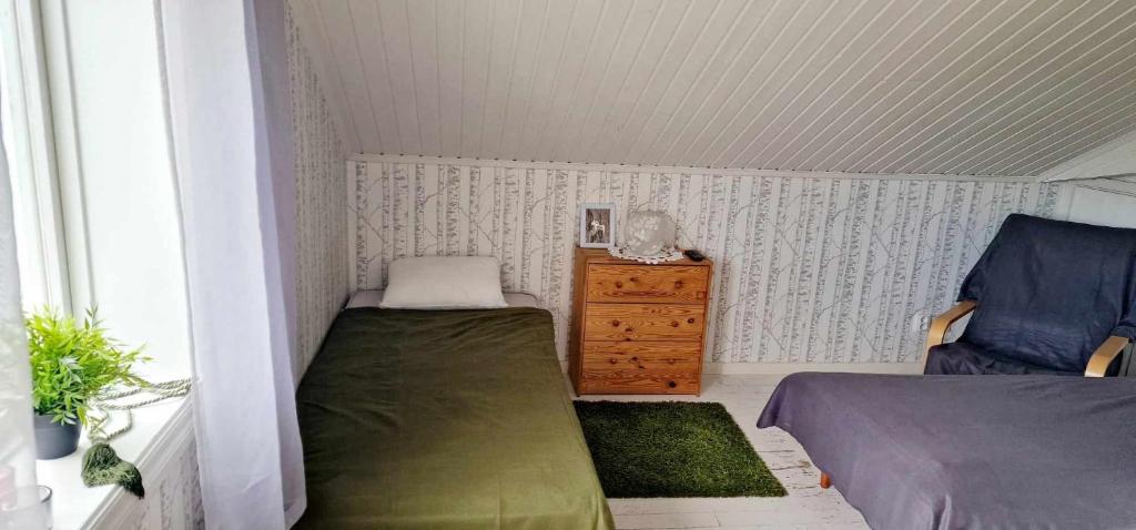 Postel nebo postele na pokoji v ubytování Berggården Vandrarhem