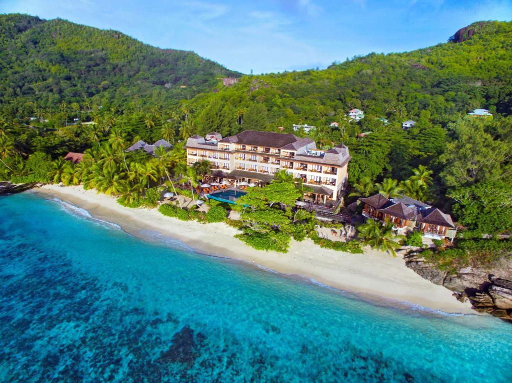 an aerial view of a resort on a beach at DoubleTree by Hilton Seychelles Allamanda Resort & Spa in Takamaka