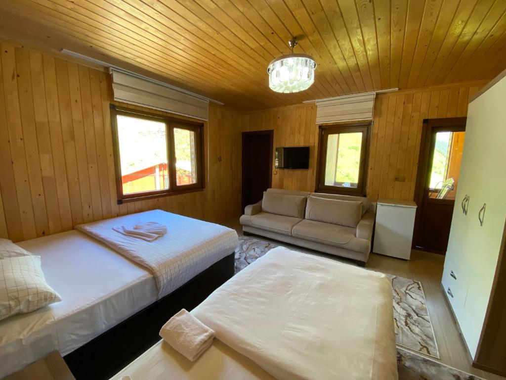 Postel nebo postele na pokoji v ubytování Yüce Suite