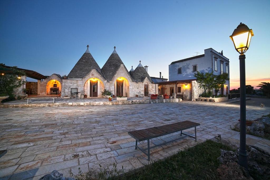 a large house with a street light in front of it at B&B Salita Delle Pere in Alberobello