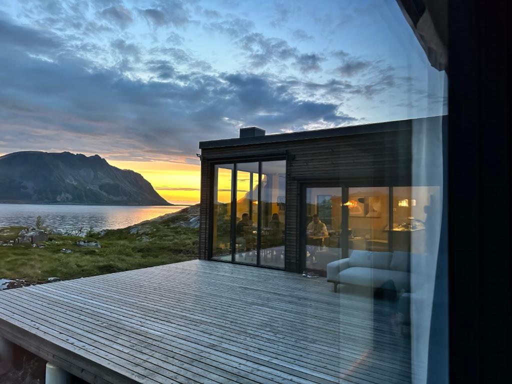 a house with a view of the ocean at NEW! Lofoten Luxury Home near Henningsvaer in Lyngværet