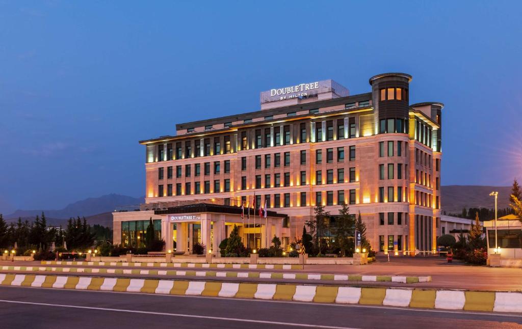 a building on a city street at night at Doubletree by Hilton Van in Van