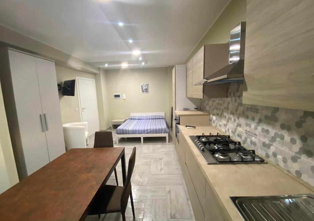 a kitchen with a counter and a stove top oven at Agriturismo I 3 Fratelli in Sala Consilina