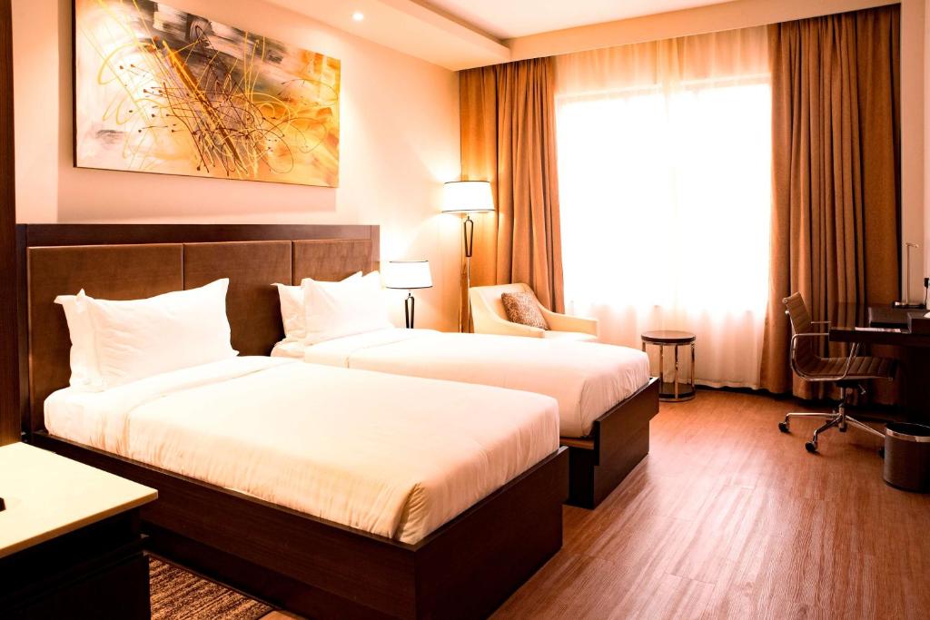 Postel nebo postele na pokoji v ubytování DoubleTree by Hilton Nairobi