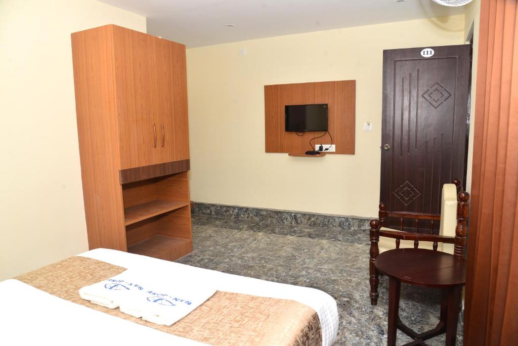 Postel nebo postele na pokoji v ubytování Sanjose Residency