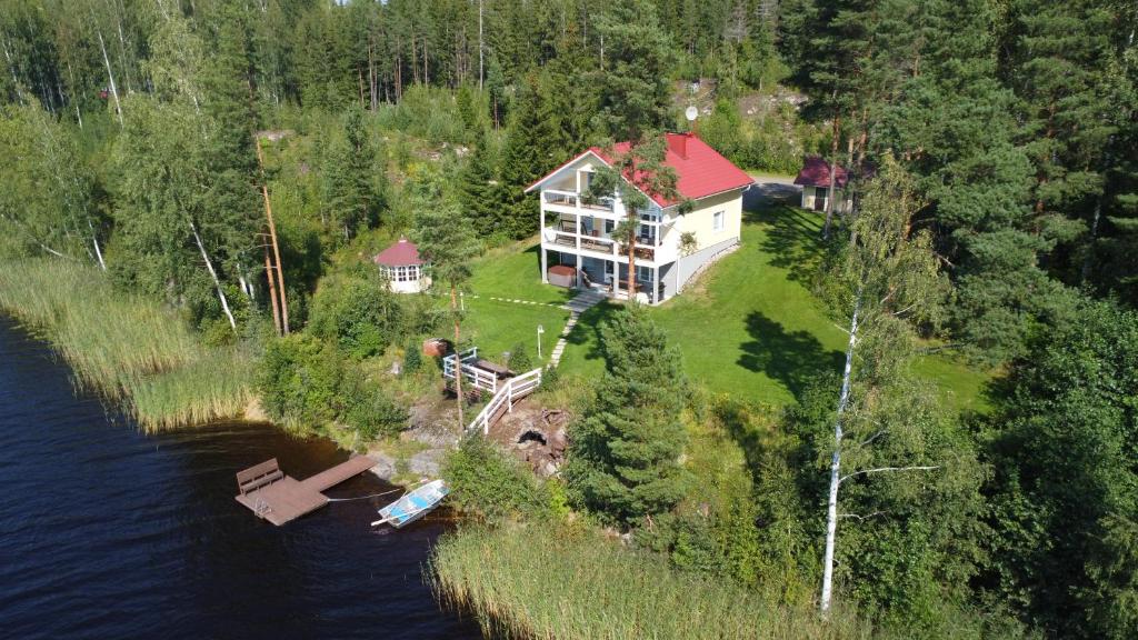 an aerial view of a large house on the water at Jacuzzi Rantakallio in Melkoniemi