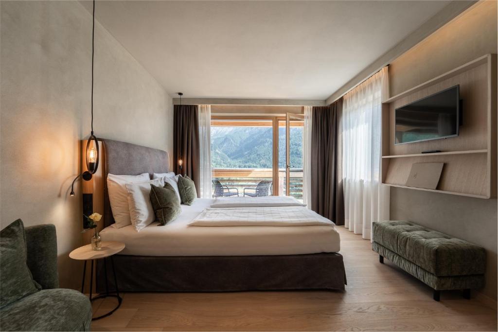 Postel nebo postele na pokoji v ubytování Hotel Valentinerhof
