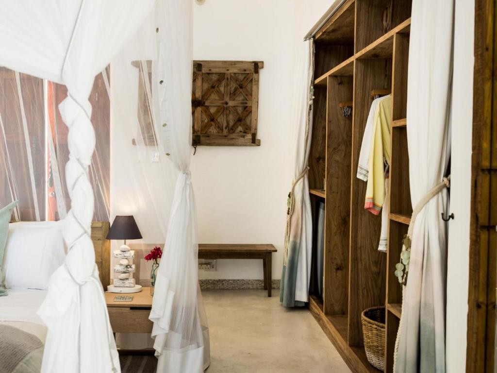 Postel nebo postele na pokoji v ubytování Villa Santorini