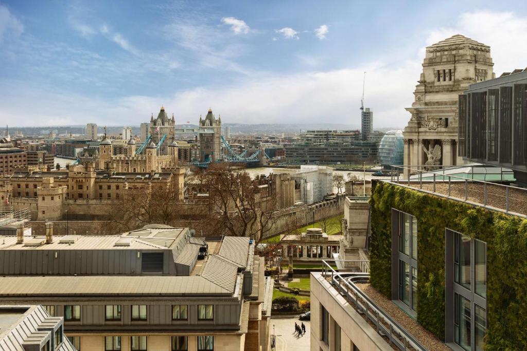 a view of the city of london from the roofs of buildings at DoubleTree by Hilton Hotel London - Tower of London in London