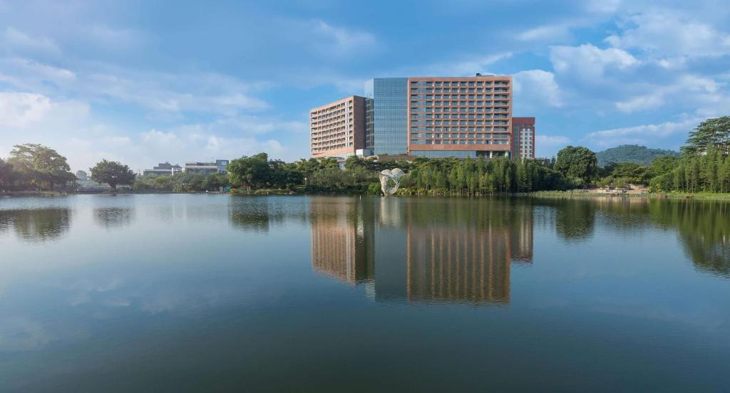 a large body of water with buildings in the background at DoubleTree by Hilton Hotel Guangzhou-Science City-Free Shuttle Bus to Canton Fair Complex and Dining Offer in Guangzhou