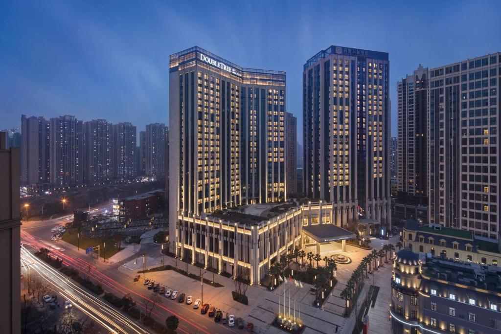 a view of a city with tall buildings and traffic at Doubletree By Hilton Chengdu Longquanyi in Chengdu